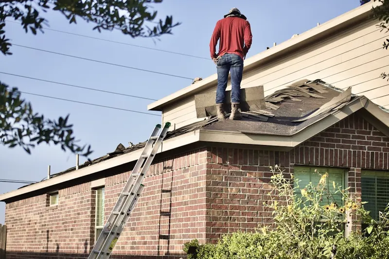 Professional roofer working on a residential roof in Rancho Adjacent